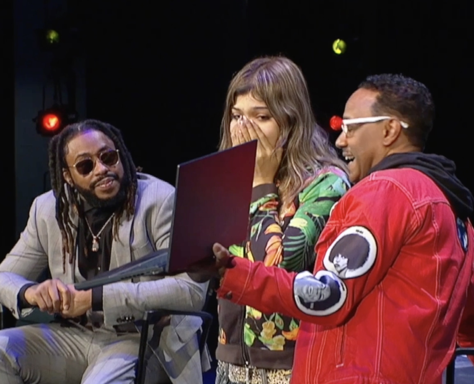 Artists performing together on stage in Baltimore